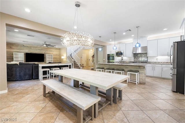 12254 Cape Cortez Ct, Las Vegas, NV 89138 - dining space featuring recessed lighting, stairs, light tile patterned floors, ceiling fan, and visible vents