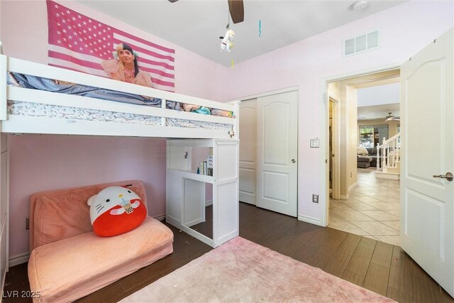 12254 Cape Cortez Ct, Las Vegas, NV 89138 - bedroom with a closet, visible vents, ceiling fan, and wood finished floors
