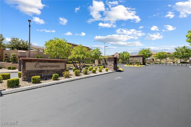 12254 Cape Cortez Ct, Las Vegas, NV 89138 - view of road with curbs, street lighting, and a gated entry