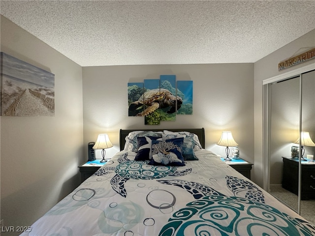 carpeted bedroom featuring a textured ceiling and a closet
