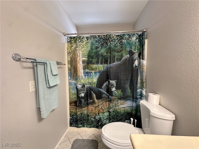 bathroom with toilet, a shower with curtain, and tile patterned flooring