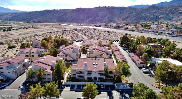 birds eye view of property with a mountain view and a residential view