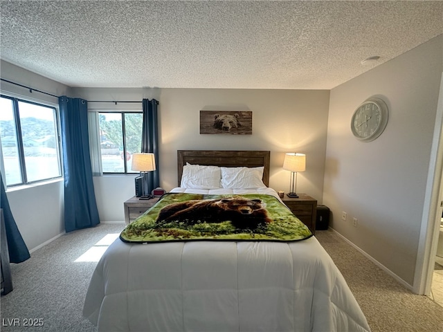 carpeted bedroom featuring a textured ceiling and baseboards