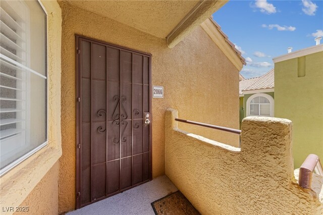 7950 W Flamingo Rd Unit 2066, Las Vegas, NV 89147 - view of exterior entry featuring stucco siding