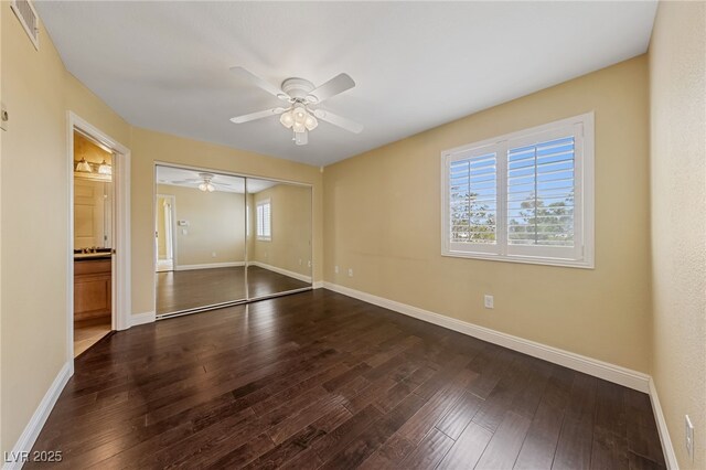 7950 W Flamingo Rd Unit 2066, Las Vegas, NV 89147 - unfurnished bedroom with hardwood / wood-style floors, baseboards, a closet, a ceiling fan, and connected bathroom