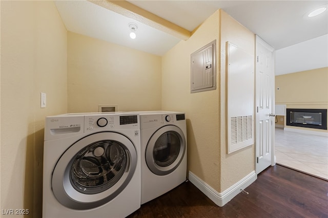 7950 W Flamingo Rd Unit 2066, Las Vegas, NV 89147 - washroom with independent washer and dryer, wood finished floors, electric panel, and baseboards