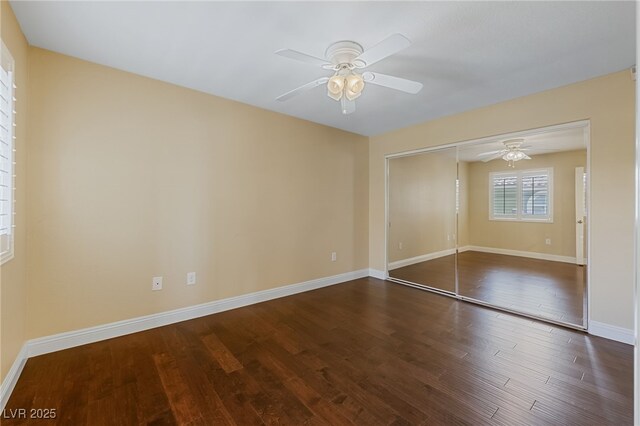 7950 W Flamingo Rd Unit 2066, Las Vegas, NV 89147 - unfurnished bedroom with wood finished floors, baseboards, a closet, and ceiling fan