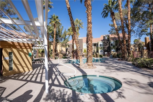 community pool featuring a pergola, fence, a patio, and a hot tub