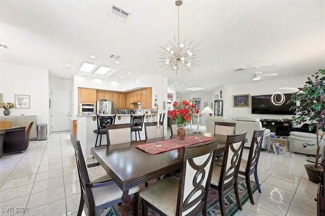 dining room with visible vents, light tile patterned floors, ceiling fan with notable chandelier, and recessed lighting