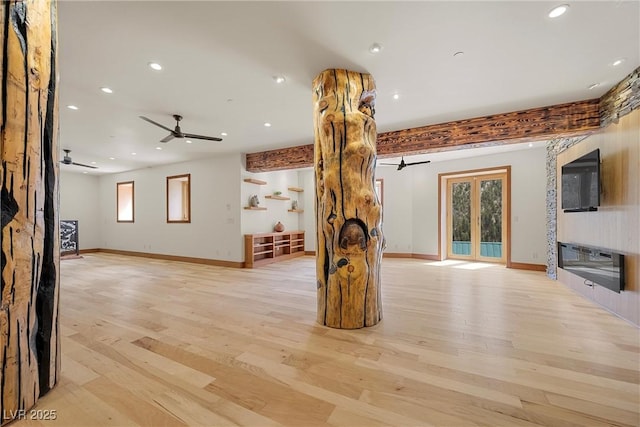 unfurnished living room featuring light wood-style floors, recessed lighting, a ceiling fan, and baseboards