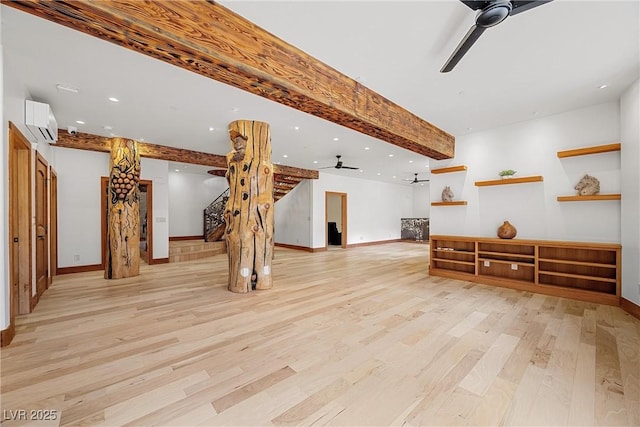 living room with ceiling fan, stairway, a wall unit AC, light wood-style flooring, and recessed lighting