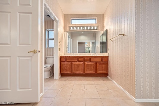 full bathroom with tile patterned floors, toilet, visible vents, and a sink