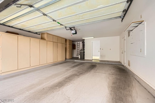 garage with visible vents and a garage door opener