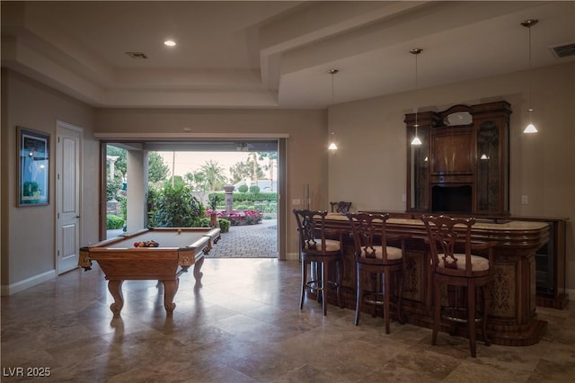 interior space with baseboards, a dry bar, a raised ceiling, and pool table