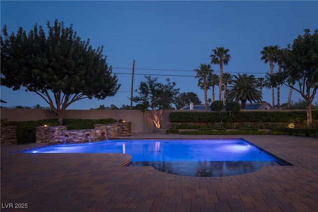 view of swimming pool featuring a fenced in pool, a fenced backyard, and a patio area