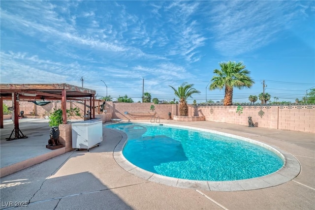 view of pool with a patio, a fenced in pool, a fenced backyard, and a pergola