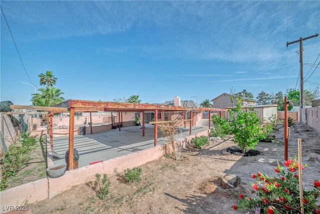exterior space with a pergola and a fenced backyard