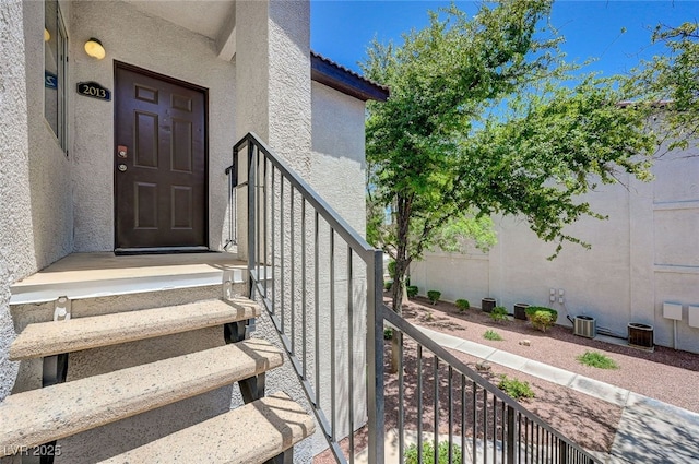2615 W Gary Ave Unit 2013, Las Vegas, NV 89123 - view of exterior entry featuring stucco siding and central air condition unit