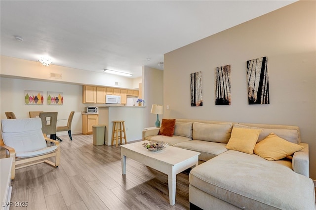 2615 W Gary Ave Unit 2013, Las Vegas, NV 89123 - living room featuring light wood-type flooring and baseboards