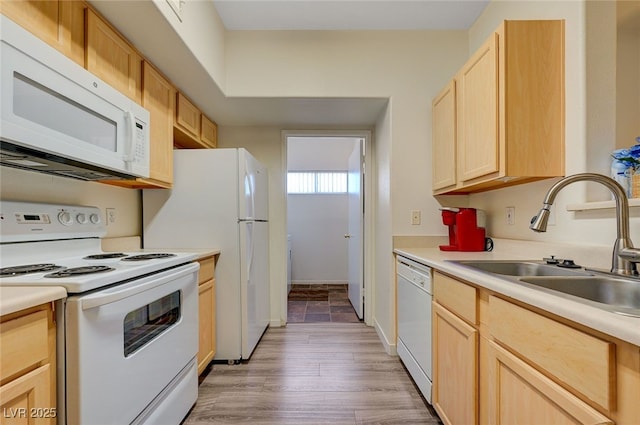 2615 W Gary Ave Unit 2013, Las Vegas, NV 89123 - kitchen featuring white appliances, light brown cabinets, a sink, light countertops, and light wood finished floors