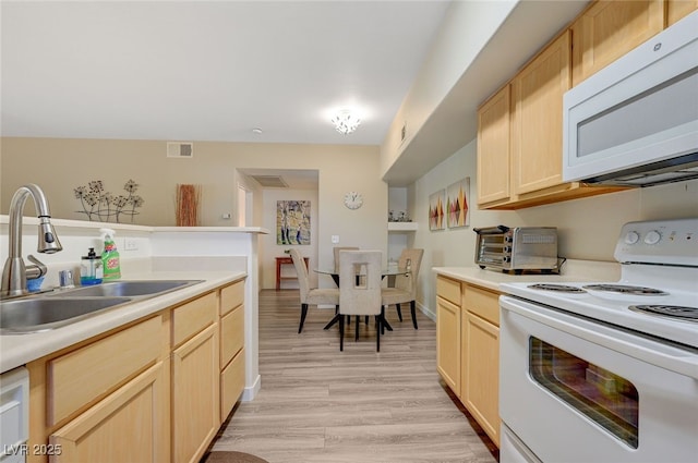 2615 W Gary Ave Unit 2013, Las Vegas, NV 89123 - kitchen with white appliances, a sink, light brown cabinets, light wood finished floors, and light countertops