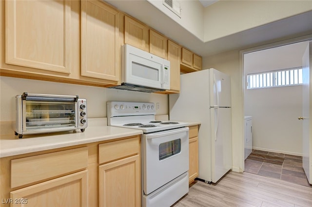 2615 W Gary Ave Unit 2013, Las Vegas, NV 89123 - kitchen featuring white appliances, light brown cabinets, light countertops, baseboards, and light wood-type flooring