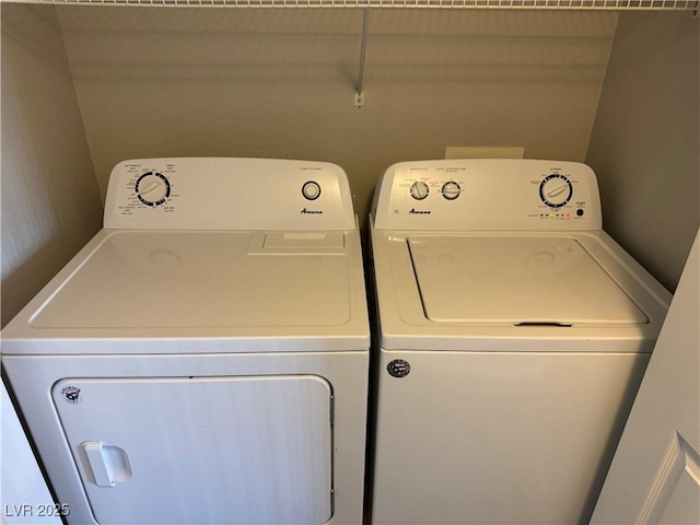 clothes washing area with independent washer and dryer and laundry area