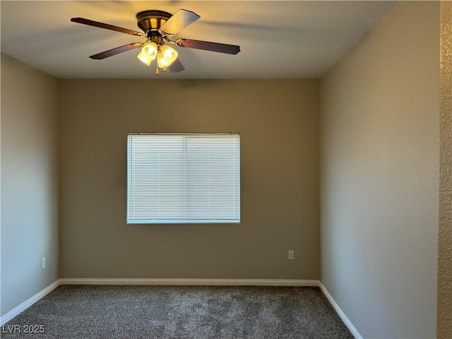 empty room with baseboards, dark colored carpet, and a ceiling fan