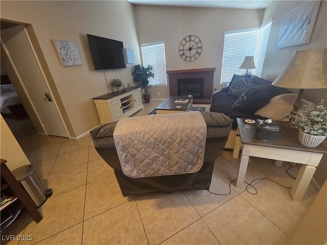 7328 Coffeyville Ave, Las Vegas, NV 89147 - living room featuring baseboards, light tile patterned flooring, and a brick fireplace
