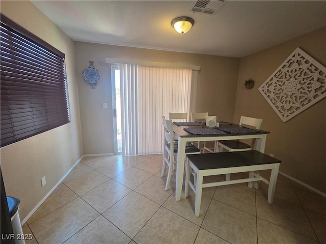 7328 Coffeyville Ave, Las Vegas, NV 89147 - dining room with light tile patterned floors, visible vents, and baseboards