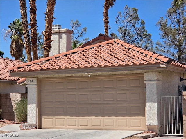 7328 Coffeyville Ave, Las Vegas, NV 89147 - garage featuring driveway