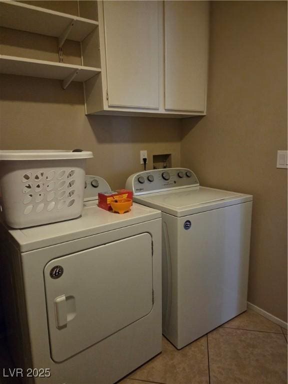 7328 Coffeyville Ave, Las Vegas, NV 89147 - laundry room featuring light tile patterned floors, baseboards, cabinet space, and washing machine and dryer