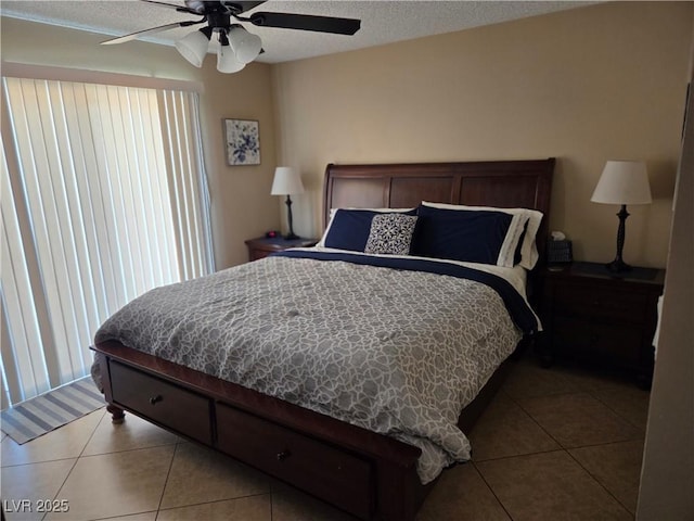 7328 Coffeyville Ave, Las Vegas, NV 89147 - tiled bedroom with a ceiling fan, a textured ceiling, and multiple windows