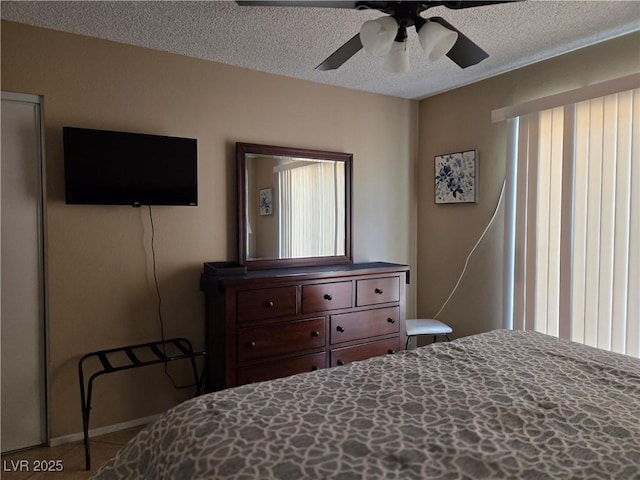 7328 Coffeyville Ave, Las Vegas, NV 89147 - bedroom with a ceiling fan and a textured ceiling
