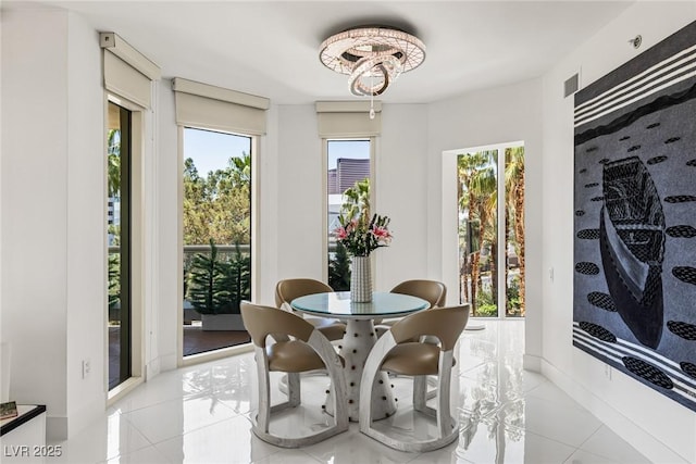 2857 Paradise Rd Unit 305, Las Vegas, NV 89109 - dining space featuring healthy amount of natural light and light tile patterned floors