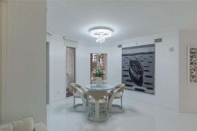2857 Paradise Rd Unit 305, Las Vegas, NV 89109 - dining area with tile patterned flooring and baseboards