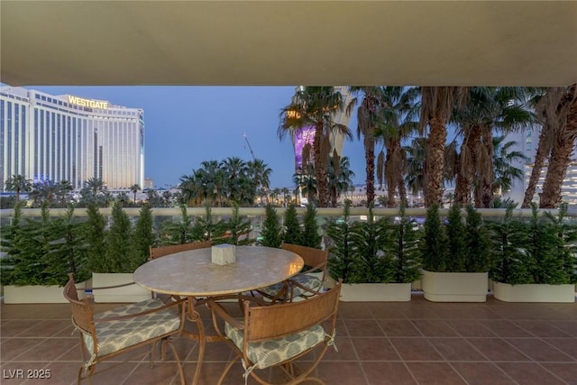 2857 Paradise Rd Unit 305, Las Vegas, NV 89109 - balcony with outdoor dining space and a patio area