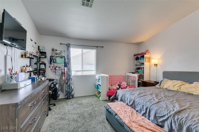 bedroom with visible vents and carpet