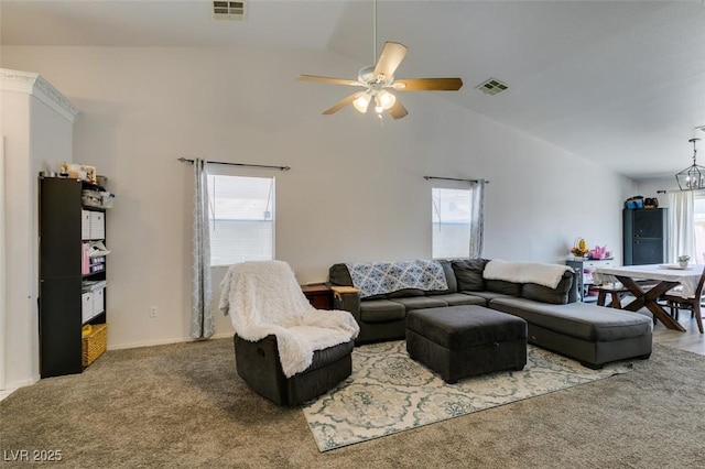 carpeted living area with visible vents, ceiling fan, and lofted ceiling
