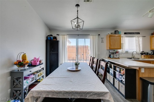 dining area featuring visible vents, wood finished floors, and a wealth of natural light