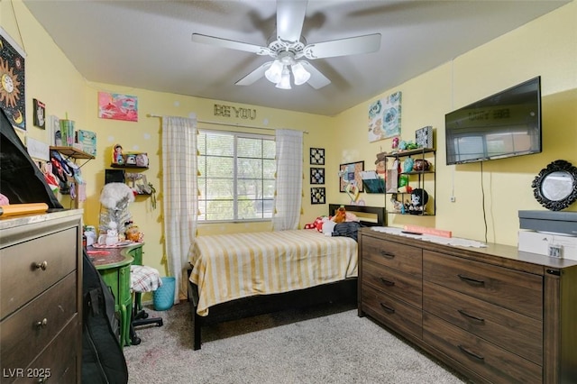 carpeted bedroom featuring ceiling fan