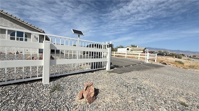 view of gate with fence