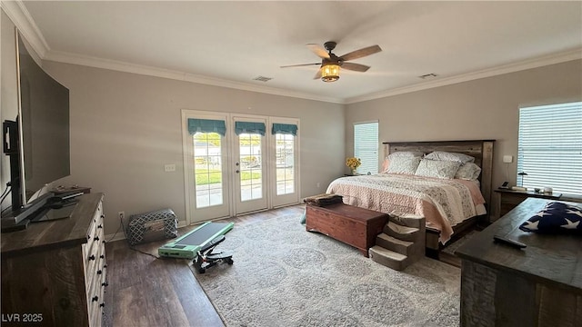 bedroom featuring wood finished floors, crown molding, visible vents, and access to outside