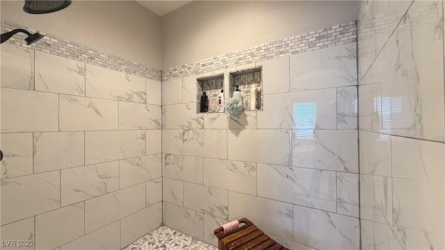 full bathroom with a tile shower