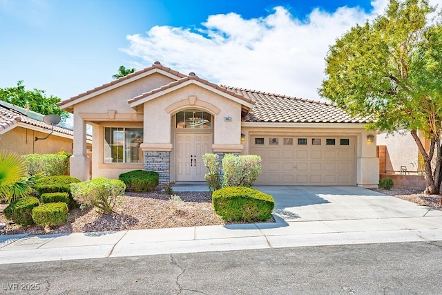 10657 Sapphire Vista Ave, Las Vegas, NV 89144 - mediterranean / spanish house featuring a tile roof, driveway, an attached garage, and stucco siding