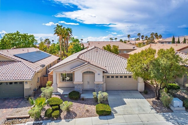 10657 Sapphire Vista Ave, Las Vegas, NV 89144 - mediterranean / spanish-style house with a tile roof, driveway, a garage, and stucco siding