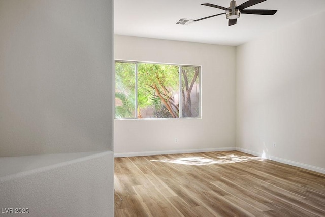 10657 Sapphire Vista Ave, Las Vegas, NV 89144 - unfurnished room featuring a ceiling fan, visible vents, wood finished floors, and baseboards