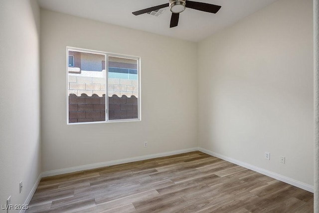 10657 Sapphire Vista Ave, Las Vegas, NV 89144 - spare room featuring visible vents, ceiling fan, wood finished floors, and baseboards