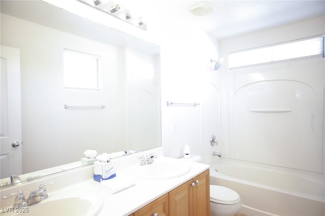 3652 Remington Grove Ave, North Las Vegas, NV 89081 - bathroom with toilet, double vanity, a sink, and shower / washtub combination