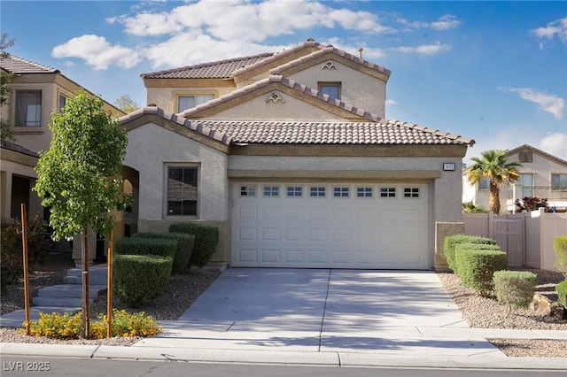 3652 Remington Grove Ave, North Las Vegas, NV 89081 - mediterranean / spanish home featuring stucco siding, driveway, a tile roof, and a garage